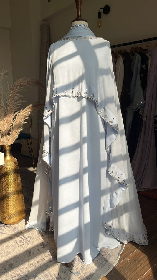 White lace dress on a mannequin with a blurred background