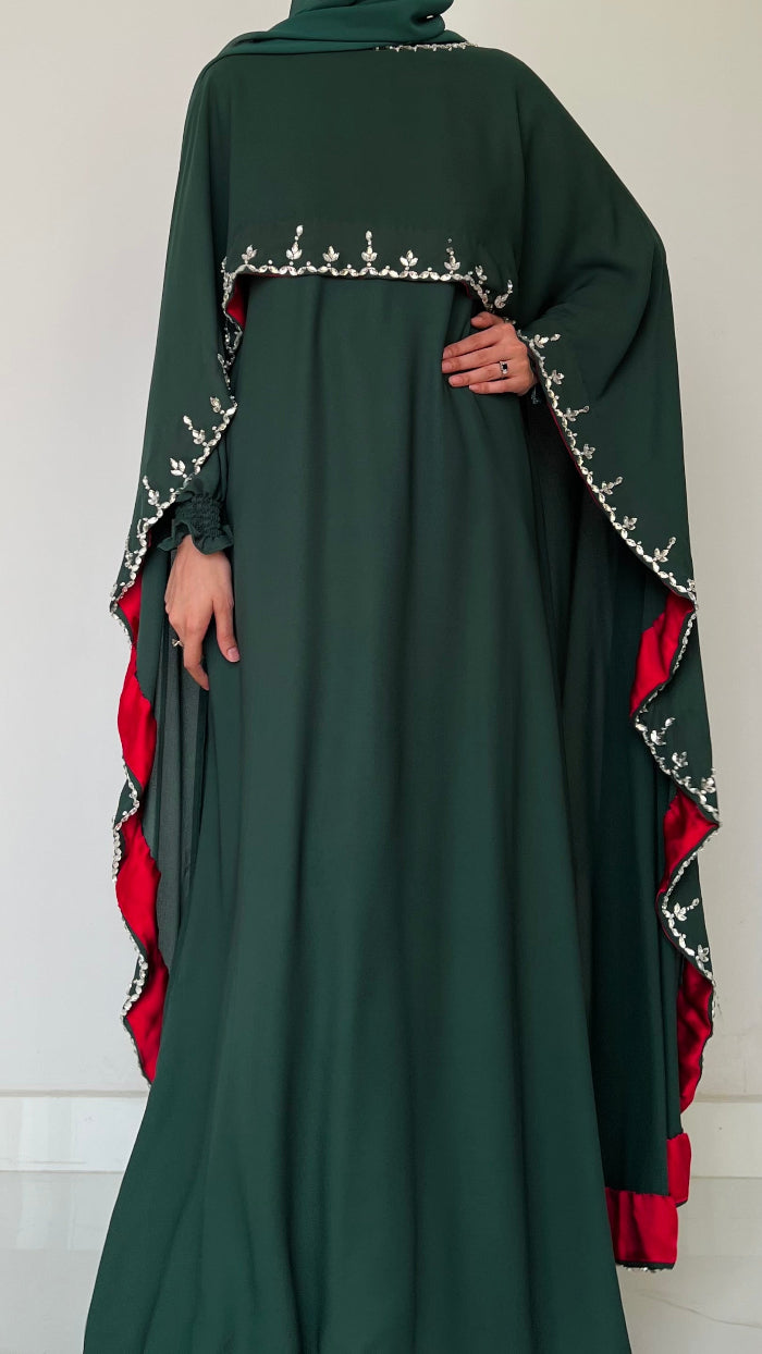 Dark green abaya with red and white embroidery on a white background