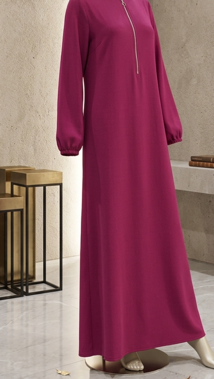 Mannequin wearing a long magenta dress in a modern interior setting
